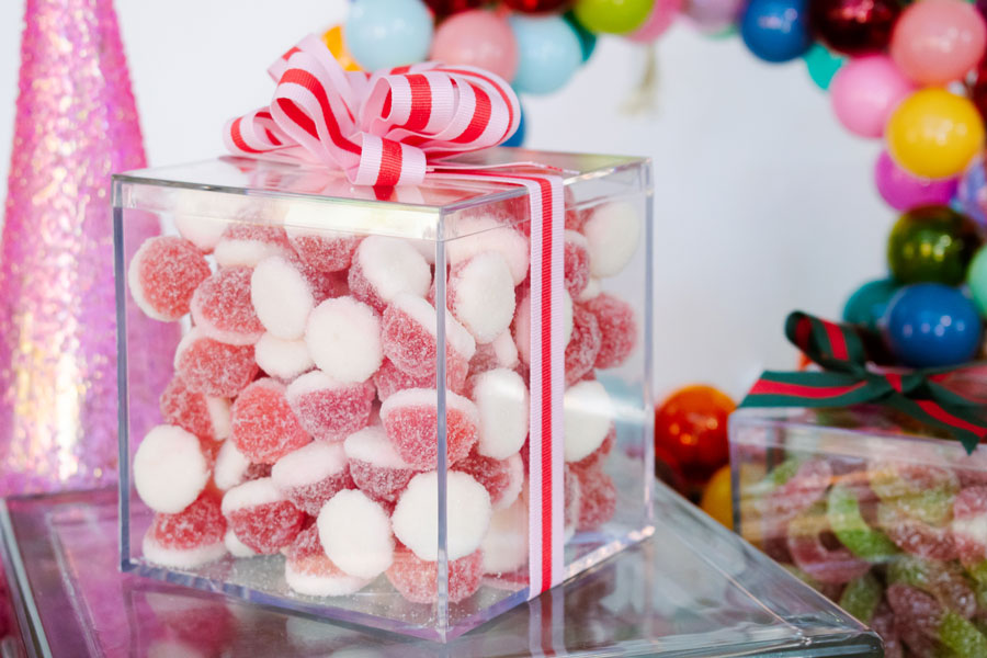 A box of candy with ribbon on it.