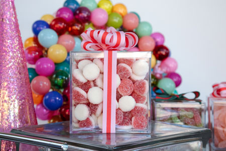 A box of candy with a ribbon on it.