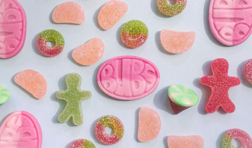 Various candies on a blue background.